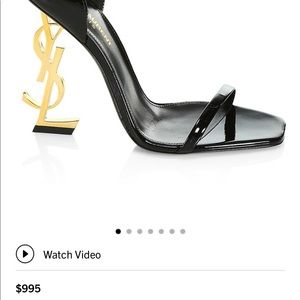 Black patent leather YSL heels with gold tone YSL . Gently Used